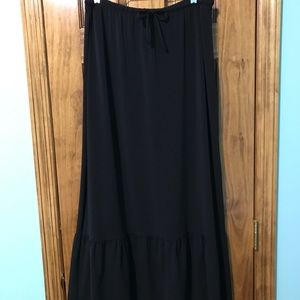 Long black skirt with large ruffle at hem